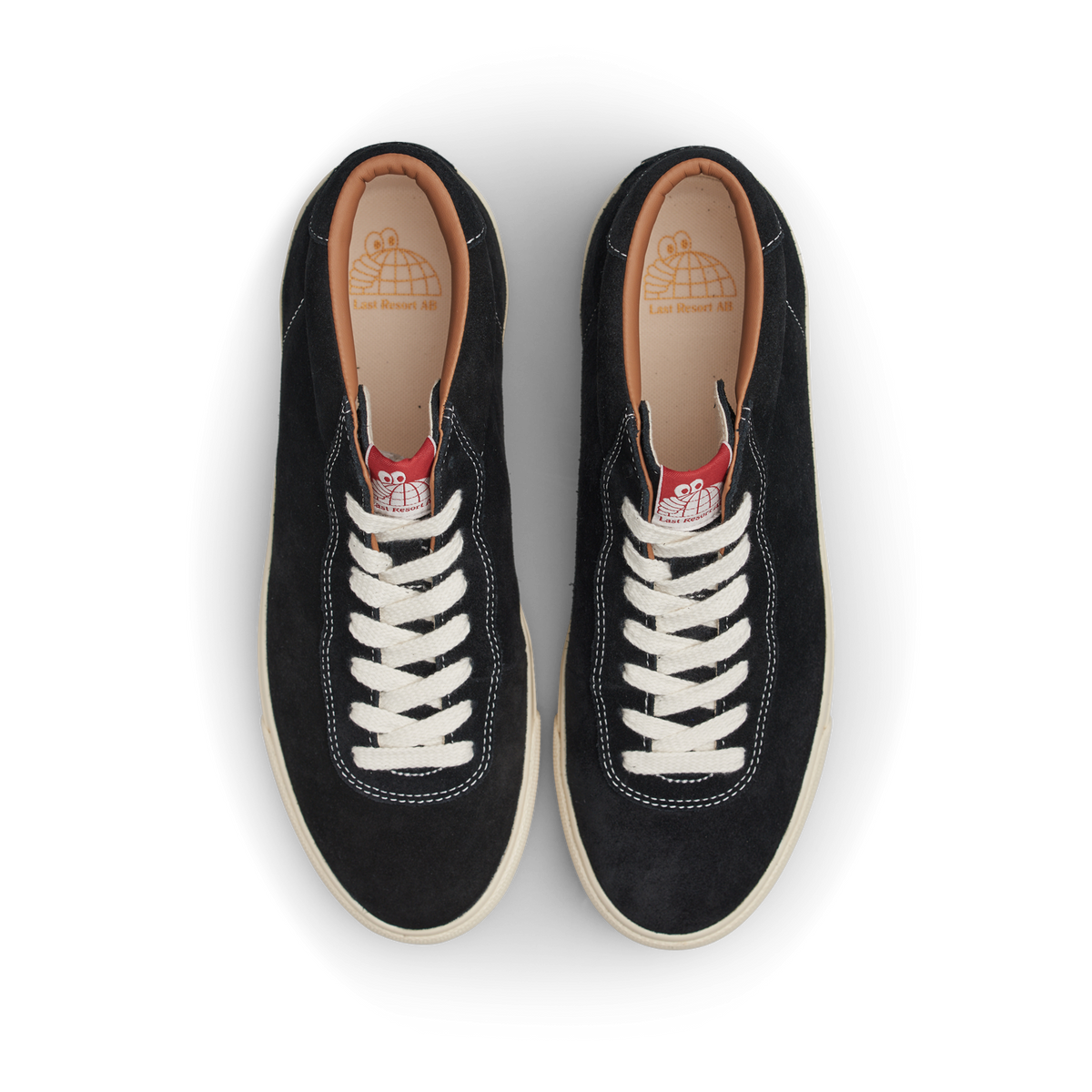 Pair of black sneakers with white laces on a white background