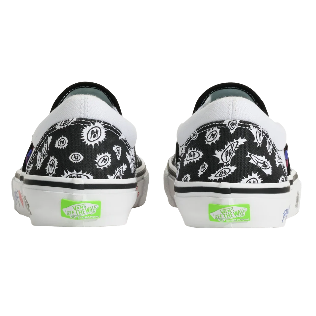A pair of Vans slip-on sneakers shown from the back, featuring a black canvas upper with a white graphic pattern, white rubber soles, and bright green Vans 'Get Up The Way' logos on the heel.
