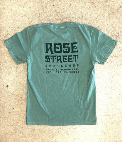 Green t-shirt with 'Rose Street Skate Shop' text on a beige background