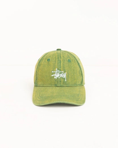 A Stüssy baseball cap in a washed olive green color with the brand's signature white logo embroidered on the front, set against a plain white background.