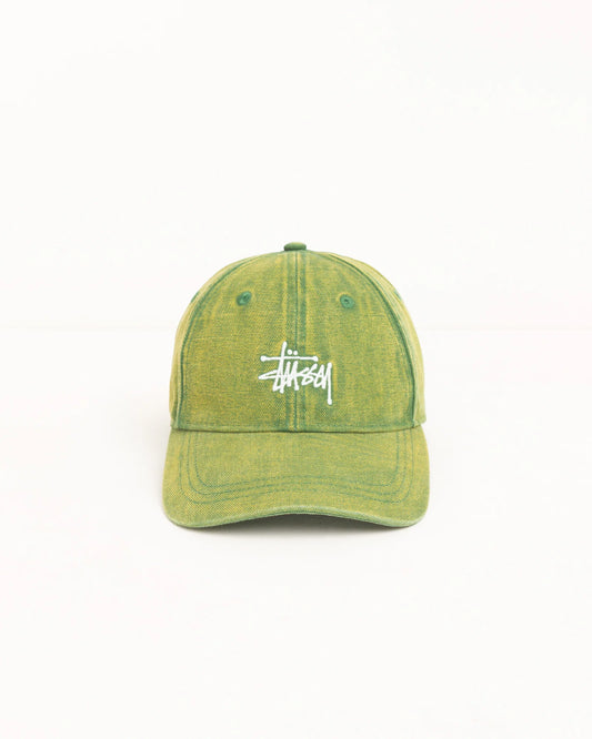 A Stüssy baseball cap in a washed olive green color with the brand's signature white logo embroidered on the front, set against a plain white background.