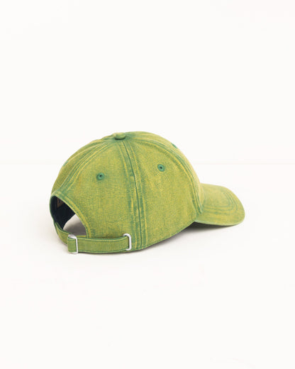 A green acid-washed baseball cap shown from a side-rear angle on a clean white background.