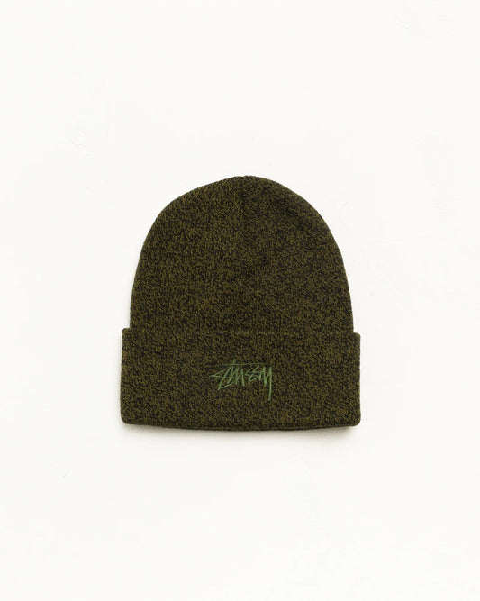 An olive green Stüssy beanie with a folded cuff and a green embroidered logo on the front, set against a plain white background.