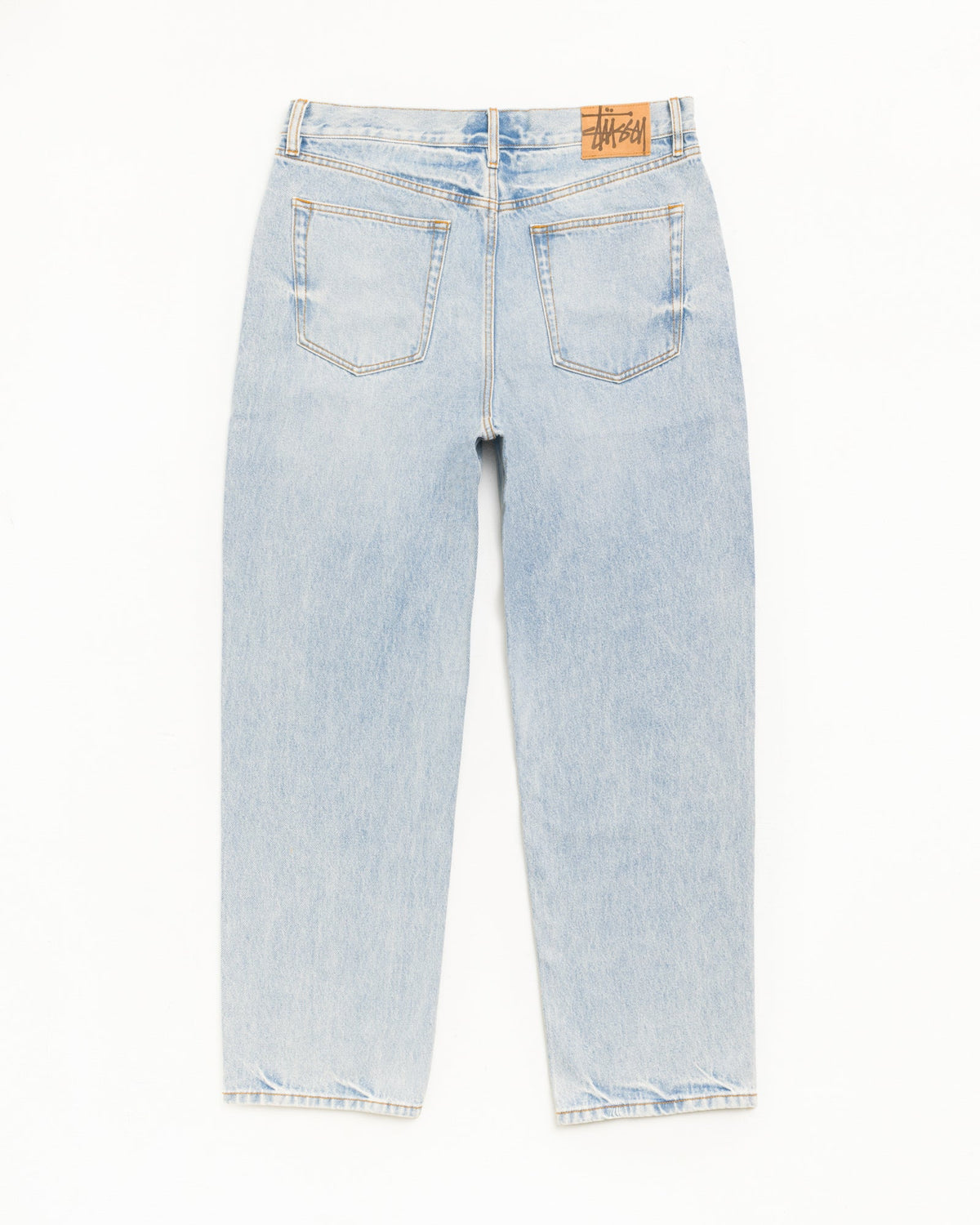 Light wash blue denim jeans shown from the back, featuring two back pockets and a brown leather brand patch on the waistband, photographed against a plain white background.