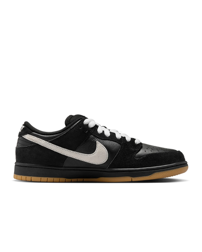 Black sneaker with white swoosh logo on a transparent background