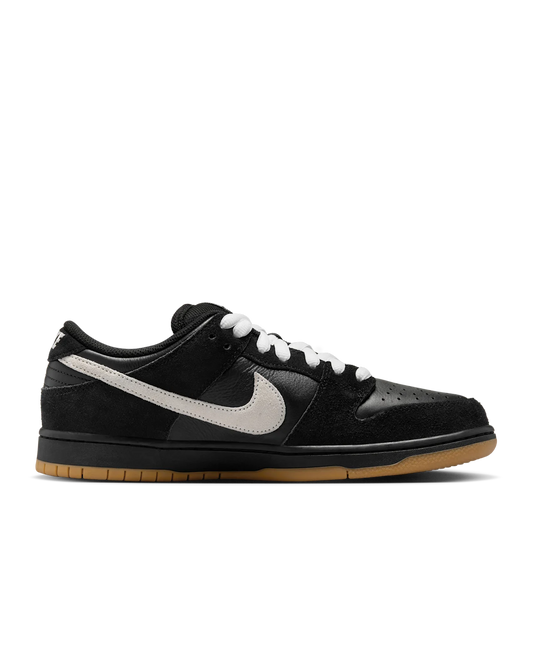 Black sneaker with white swoosh logo on a transparent background